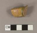 Undecorated lead glazed redware handle sherd