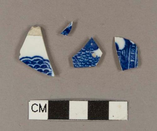 Blue hand painted whiteware body sherds; two sherds crossmend