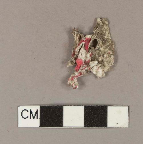 Red-printed white synthetic sheet fragment