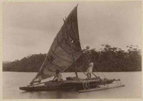 People on canoe with sail