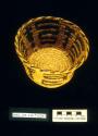 Coiled bowl-shaped basket with slightly flared rim