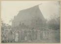 Line of people in front of building