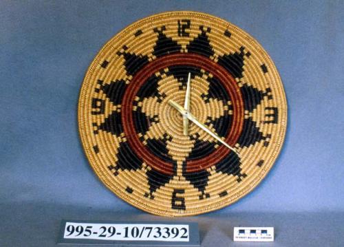 Coiled circular clock (A) with mechanism and hands (B)