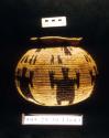Coiled basketry "Guerregue Cholo" globular jar with human figure motif