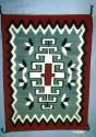 Klagetoh rug, central red cross within white hooked diamond, red border