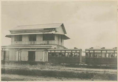 Train with Filipino prisoners, American dead, wounded