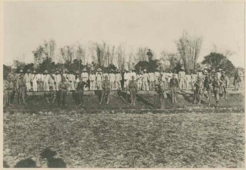 American soldiers marching captured Filipino soldiers