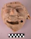 Pottery vessel fragment with large relief face.