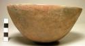 Ceramic, complete vessel, bowl, plain, contains beans.