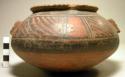 Ceramic bowl, flaring rim, chipped, polychrome exterior, flat base