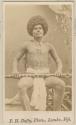 Posed studio portrait of man with club