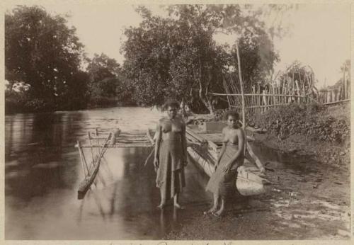 Two women with double canoe