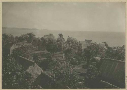 Group of buildings, with shore in background