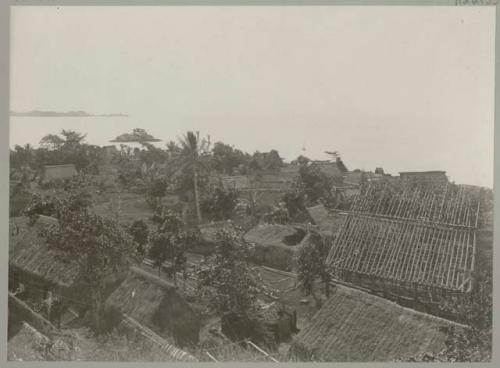 Group of buildings, with shore in background