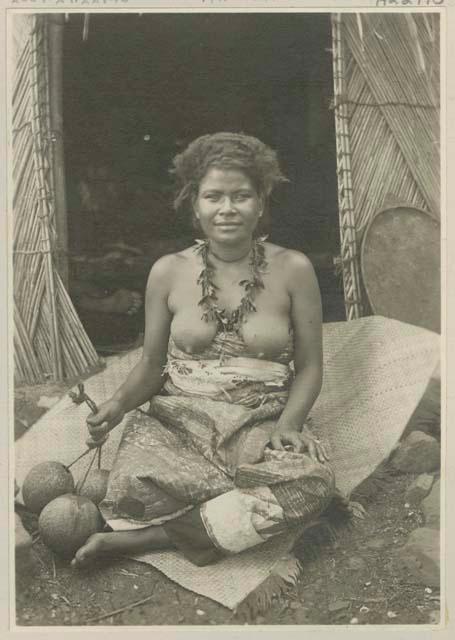 Woman seated on mat