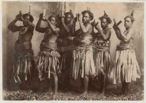 Group of meke dancers holding clubs