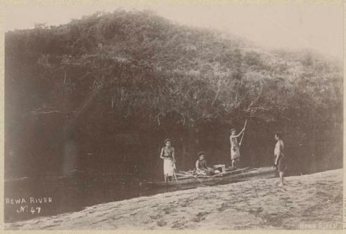 Three men in canoe on Rewa River, one man standing on shore