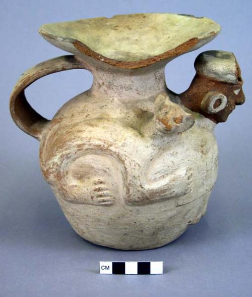 Vase, with handle, animal and human faces