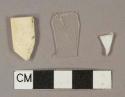 White plastic fragments, 1 colorless plastic fragment