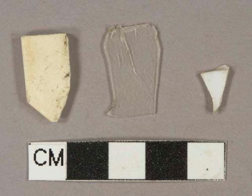 White plastic fragments, 1 colorless plastic fragment