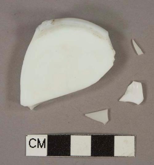 White milk glass vessel body and base fragments