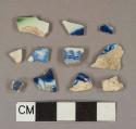 Blue on white transfer-printed pearlware vessel body and rim fragments, light buff or white paste, 1 green shell-edged decorated