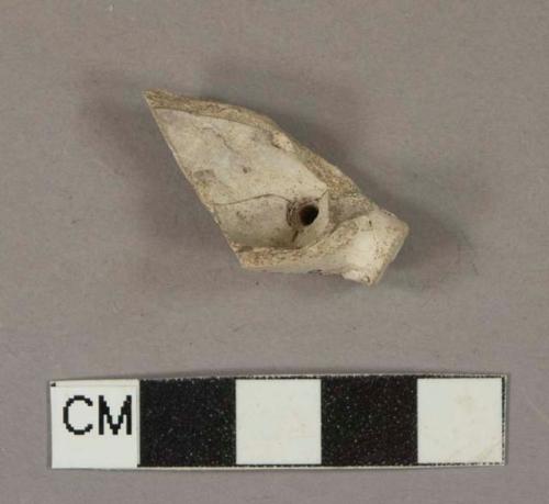 White kaolin pipe bowl fragment, molded decorations on foot