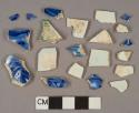 Blue on white transferprinted pearlware vessel body fragments, white paste, 1 green shell-edged rim fragment