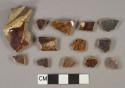 Brown slip-glazed earthenware vessel body fragments, buff paste, likely rockingham type