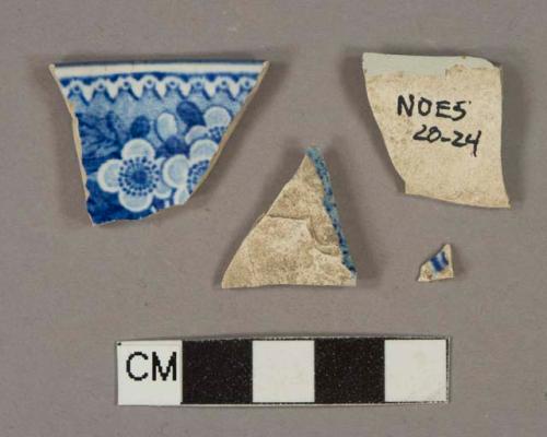 Blue on white transfer-decorated pearlware vessel rim and body fragments, white paste