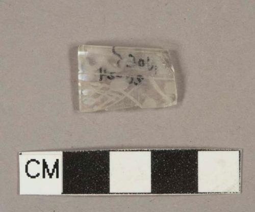 Colorless glass vessel rim fragment, etched decoration