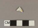 Polychrome hand painted whiteware body sherd with some overglaze painting; floral design