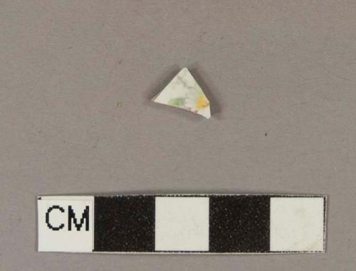 Polychrome hand painted whiteware body sherd with some overglaze painting; floral design