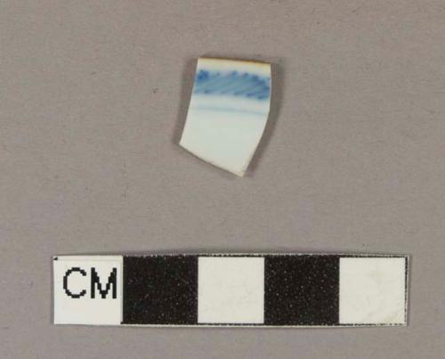 Blue hand painted porcelain rim sherd with brown glazed rim