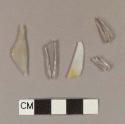 Colorless flat glass fragments; two fragments crossmend