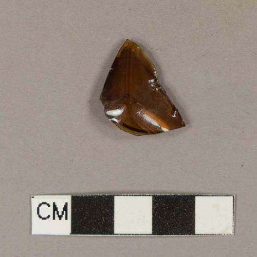 Molded amber bottle glass fragment with small bit of embossed letter