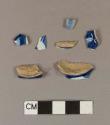 Blue hand painted tin glaze earthenware body sherds; four sherds crossmend