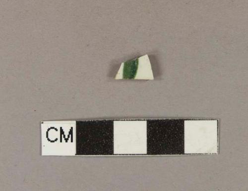 Green hand painted whiteware body sherd