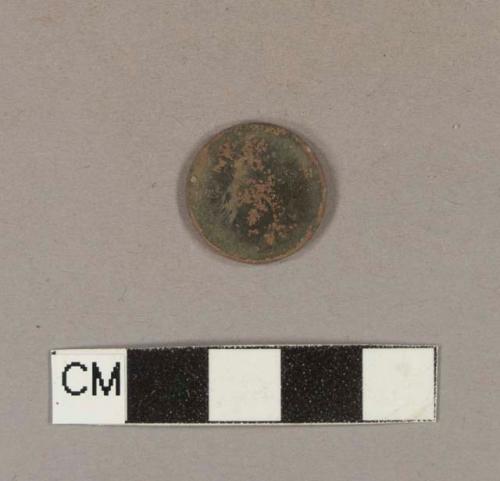 Round copper alloy object with fragments of gilding; possibly a button missing shank