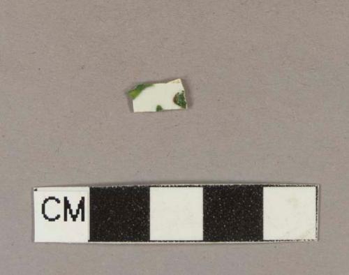 Brown and green hand painted whiteware body sherd