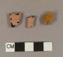 Undecorated lead glazed redware body sherds; two sherds crossmend