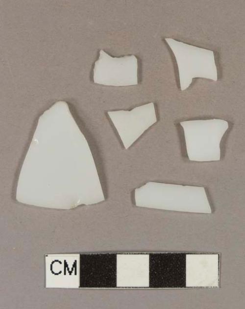 Milk white bottle glass fragments