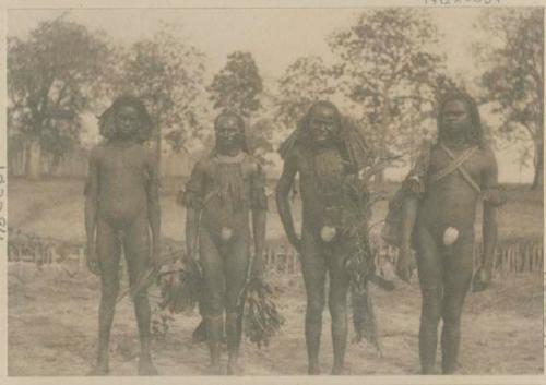 Four men standing outside