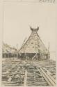 Thatched, pointed, structure, possibly pile dwelling