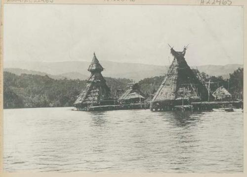 Thatched, pointed pile dwellings