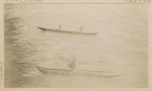 People in outrigger canoes