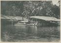 People in canoes at piers