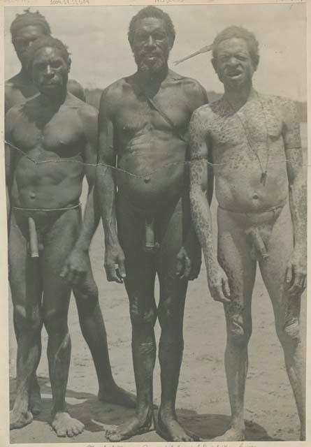 Four men standing outside