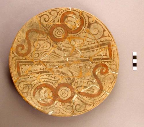 Fragmentary plate- white slip, red  & brown decoration