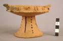 Pottery bowl with holloe pedestal base; applique design;